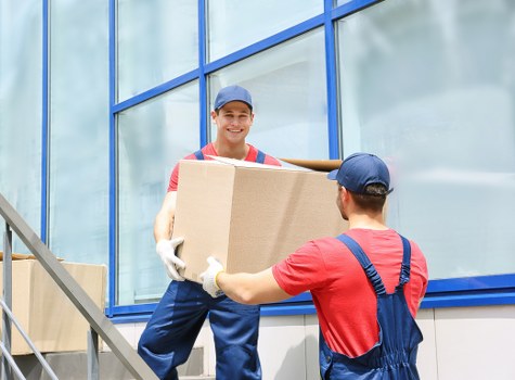 Local van service loading furniture near West Hampstead flats