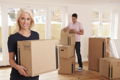 Moving team unloading boxes at a West Hampstead home