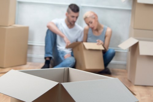 Local moving team handling boxes and furniture in West Hampstead