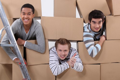Packed moving boxes and wrapped household items ready for transport