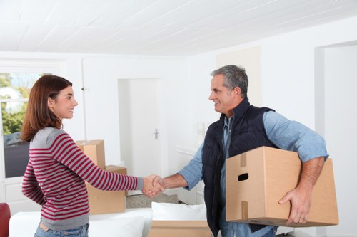Commercial moving van loading office items in West Hampstead