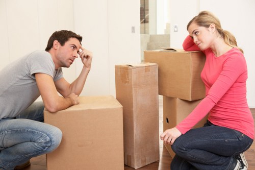 Packed moving boxes and furniture ready for transport in West Hampstead