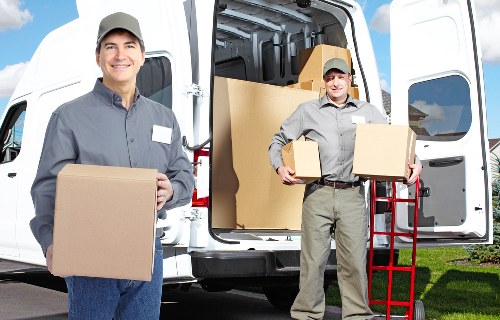 Packed boxes and furniture ready for a local house move in West Hampstead