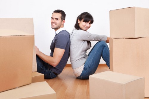 Professional movers handling furniture in a West Hampstead flat