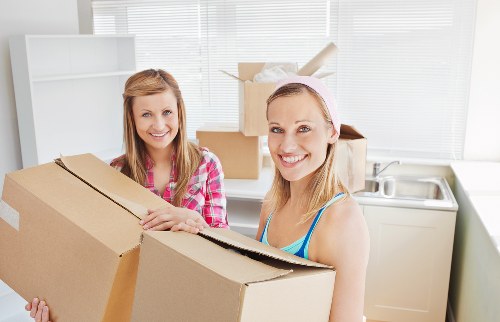Loading furniture into a moving truck for a West Hampstead relocation