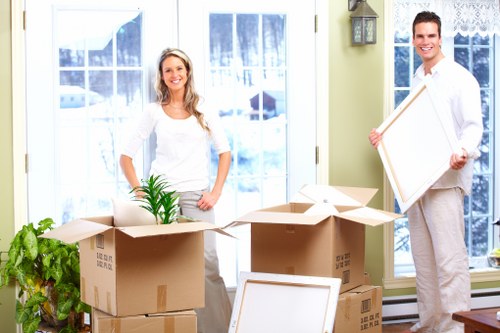House movers handling furniture near local flats and period homes